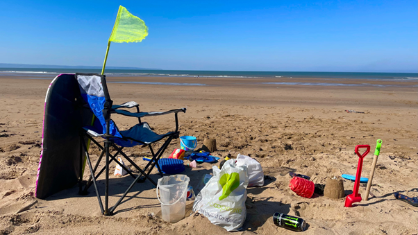 Picture showing assortment of items left on the beach by visitors